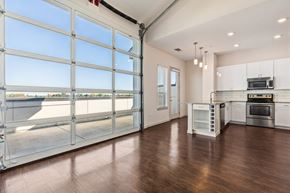 Denver apartment for rent - A spacious kitchen with a large window and a view of the outdoors.