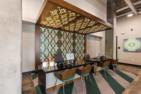 Denver apartment for rent - A conference room with a long table and chairs.