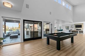 Richland apartment for rent - a living room with a pool table in the middle of it
