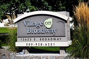 Spokane Valley apartment for rent - Village on Broadway Apartments in Spokane Valley, Washington Monument Sign