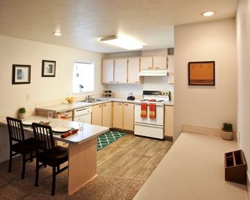 Spokane Valley apartment for rent - A kitchen with a table and chairs.