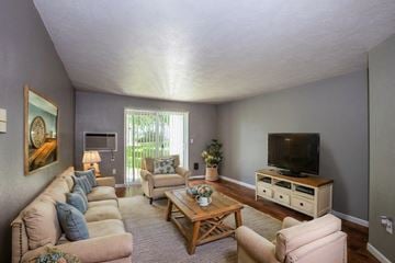 Spokane Valley apartment for rent - a living room with a couch and a television