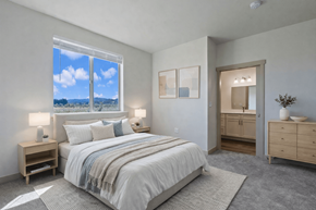 Eugene apartment for rent - Lark View Village Apartments in Eugene, OR Bedroom with a large bed and a view of the sky through the window.