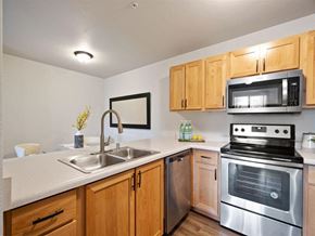 Pasco apartment for rent - Kitchen with Dishwasher and View into Dining Room at The Crossings at Chapel Hill, Pasco