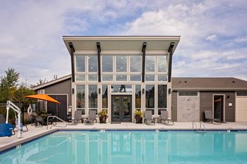 Sparkling outdoor pool and fire table