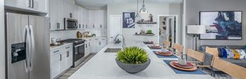 Quartz kitchen countertops with tile backsplash