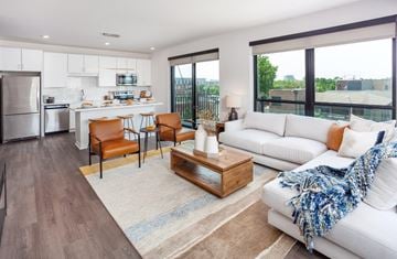 Kansas City apartment for rent - a living room with a couch and a table