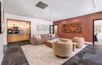 Dallas apartment for rent - A living room with a brown sofa and a coffee table.