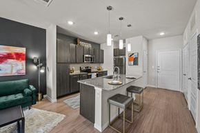 San Antonio apartment for rent - a kitchen and living room with a marble counter top