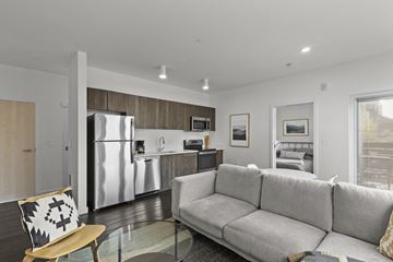 Bend apartment for rent - a living room with a couch and a glass table