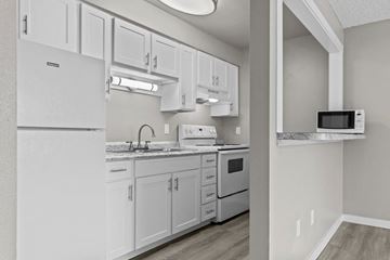 Spokane apartment for rent - A kitchen with white cabinets and appliances.