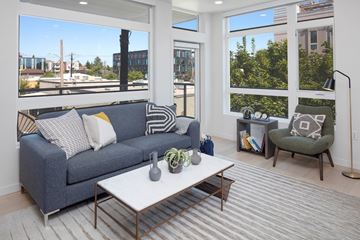 Portland apartment for rent - A living room with a grey couch and a white coffee table.