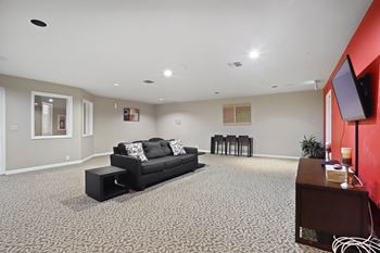 Keeler's corner apartments tv lounge with couch and tables