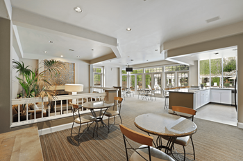 Keeler's corner apartments community lounge and kitchen with seating
