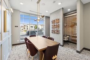 Denver apartment for rent - A conference room with a long table and chairs.