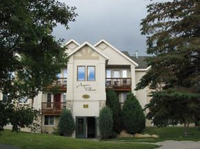 Park City apartment for rent - the front view of an apartment building with trees