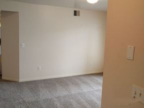 Park City apartment for rent - a living room with white walls and a carpeted floor