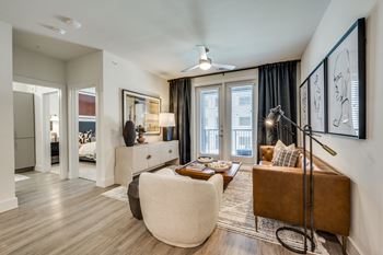 Wood-style flooring in living, dining, and bath areas
