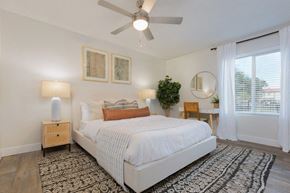 Phoenix apartment for rent - a bedroom with a bed and a ceiling fan