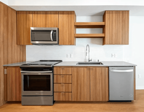 Bainbridge apartment for rent - A modern kitchen with wooden cabinets and stainless steel appliances.