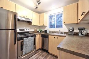 Vancouver apartment for rent - Kitchen with stainless steel appliances and window at Block 88 Townhomes in the Hazel Dell neighborhood in Vancouver, Washington.