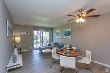 Denver apartment for rent - A dining room with a table set for two and a ceiling fan.