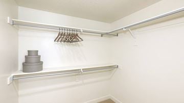 West Jordan townhouse for rent - A white closet with a shelf and a hanger.