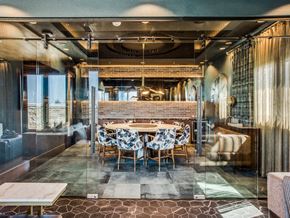 Dallas apartment for rent - a dining room with a long table in the middle of it