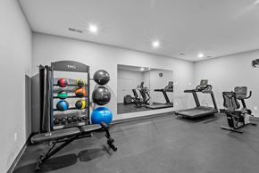 Corvallis apartment for rent - A gym with a variety of equipment including a treadmill, rowing machine, and exercise balls.