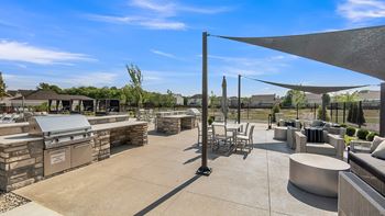 Stainless steel outdoor grilling stations with comfortable lounge seating