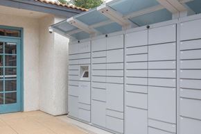 Tucson apartment for rent - A series of mailboxes are lined up on the side of a building.