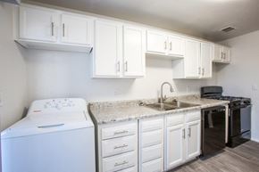 Tucson apartment for rent - A white laundry room with a washer and dryer.