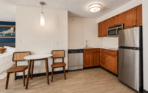 Houston apartment for rent - A kitchen with a table and chairs.