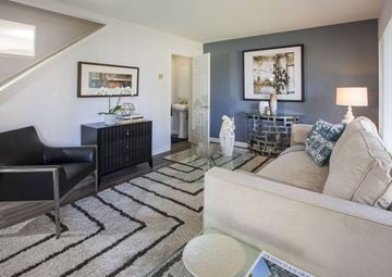 San Pedro apartment for rent - a living room with a couch and a chair and a rug