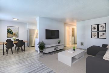 Bend apartment for rent - a living room with a couch and a table and a television