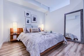 Seattle apartment for rent - a bedroom with a large mirror and a bed at Wilcox, Seattle, Washington