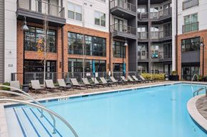 Suwanee apartment for rent - Skye Suwanee Town Center Apartments in Suwanee, Georgia Pool with Lounge Chairs