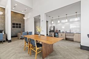 Allen apartment for rent - A dining room with a wooden table and chairs.