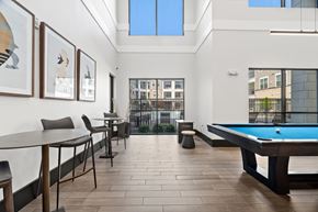 Allen apartment for rent - A room with a pool table and a view of the city.