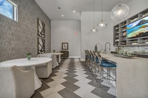 North Richland Hills apartment for rent - A modern dining room with a long table and chairs.