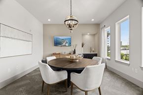 San Antonio apartment for rent - A modern dining room with a wooden table and chairs.