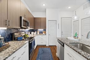 Garland apartment for rent - Woodlands at the Preserve Apartments in Garland, Texas Model Kitchen