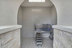 Austin apartment for rent - A kitchen with a stainless steel counter and a tiled floor.