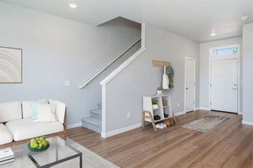 Vancouver apartment for rent - A living room with a white couch and a glass coffee table.