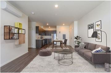 Gresham apartment for rent - A modern living room with a grey sofa and a coffee table.