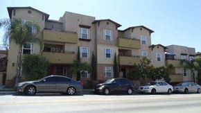 San Diego apartment for rent - A row of houses with cars parked in front.