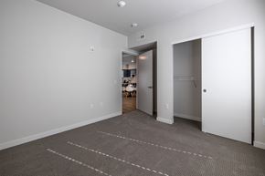 Wenatchee apartment for rent - A room with a carpeted floor and two white doors.