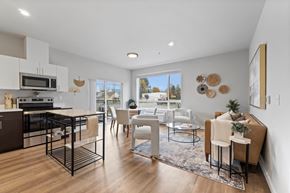 Post Falls apartment for rent - A modern kitchen with a dining area and a view of the outdoors.
