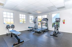 Sierra Vista apartment for rent - A gym with a treadmill, exercise bike, and rowing machine.