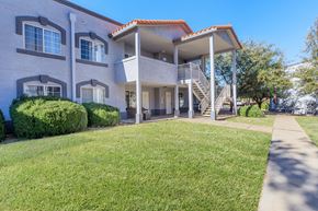 Sierra Vista apartment for rent - A two-story house with a red tile roof and a balcony on the second floor.